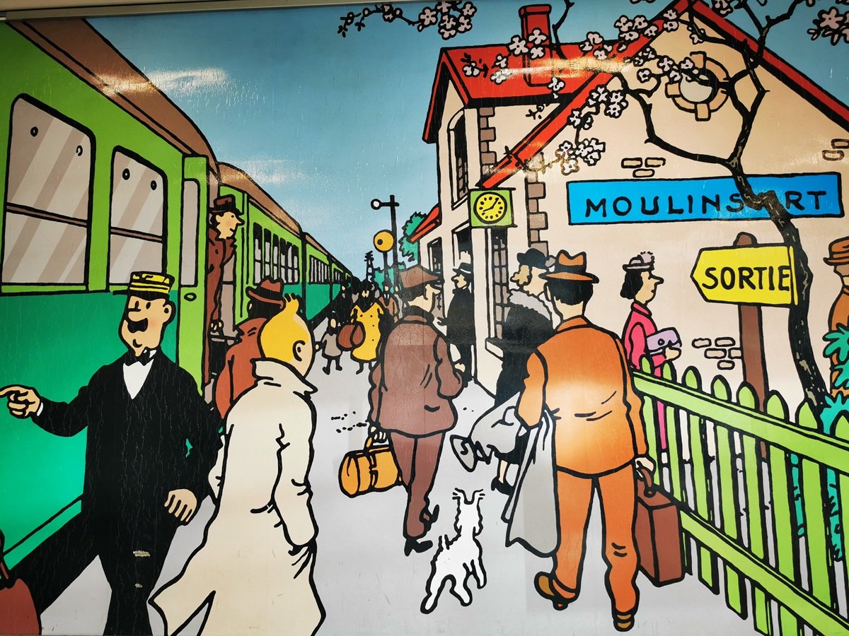 Mural depicting characters from the Tin Tin cartoon at a railway station